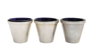 A set of three silver measuring cups