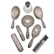 A collection of Edward VII and George V silver mounted dressing table items