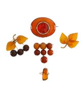 Four amber brooches and an insect amber ring