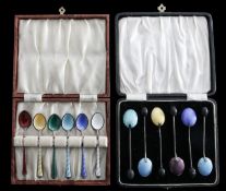 Two cased sets of guilloché enamel coffee spoons