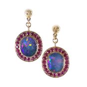 A pair of opal and ruby ear pendants