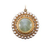 An Edwardian chrysoberyl cats eye and diamond pendant