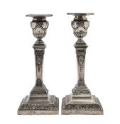 A pair of Victorian silver Neoclassical candlesticks