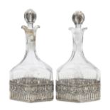A pair of German silver mounted decanters