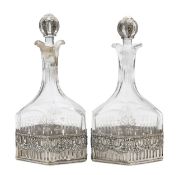 A pair of German silver mounted decanters