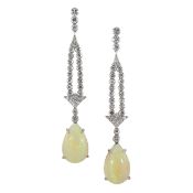 A pair of cocktail ear pendants set with opal and diamonds
