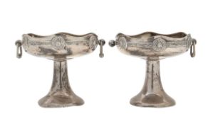 A pair of Arts and Crafts silver pedestal dishes