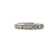 An 18ct white gold and diamond half eternity ring