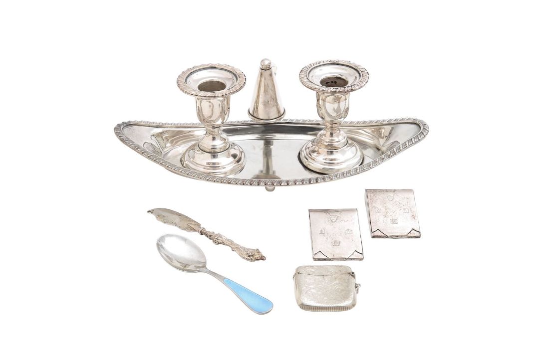 Three silver vestas, a silver knife and spoon, and a silver-plated inkwell