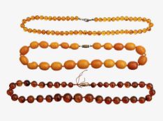 Three amber beaded necklaces
