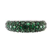 A contemporary green garnet bombe dress ring