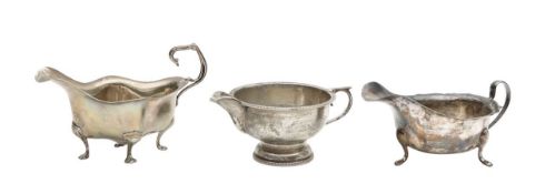 Two silver sauceboats, and a cream jug