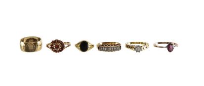 An 18ct diamond set ring and five gem set rings