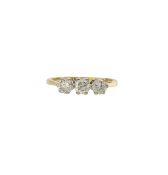 An 18ct gold three stone diamond ring
