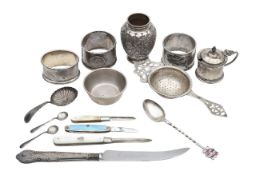 A collection of silver cruets and napkin rings