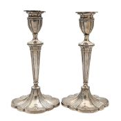 A pair of George V silver candlesticks