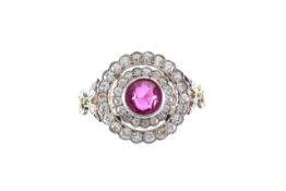 A natural pink sapphire and diamond ring