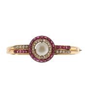 A French bangle set with ruby diamond and pearl