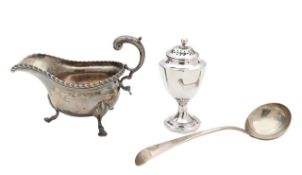 A George III silver sifter, a George III ladle, and a Victorian sauceboat