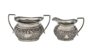 An Edward VII silver cream jug and sugar bowl