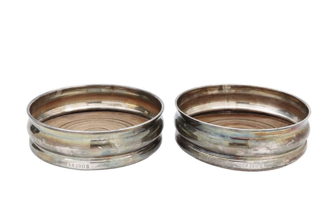 A pair of silver wine coasters - Image 1 of 2