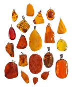 A large collection of amber pendants