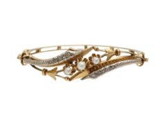 A rose cut diamond seed pearl crossover design bangle