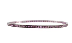An Edwardian ruby armlet bangle