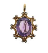 An amethyst and seed pearl pendant with brooch clasp