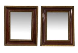 A pair of veneered and parcel-gilt wall mirrors