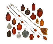 A collection of Chinese amber snuff bottles and pendants