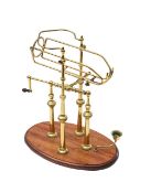 A brass wine decanter or pourer