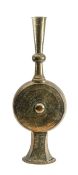 A Near Eastern floor standing brass and copper lamp