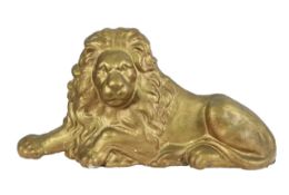A gilt painted cast iron lion
