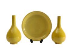 A pair of Chinese monochrome yellow glazed vases, and a dish on stand
