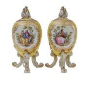 A pair of KPM Berlin porcelain egg shaped vases and covers