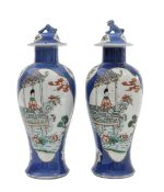 A pair of Chinese famille verte porcelain vase and covers
