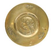 An Arts and Crafts brass charger