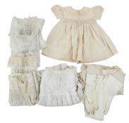 Seven Christening gowns and a pair of leather gloves