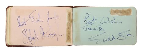 An Autograph book featuring signatures from Orson Welles, Eartha Kitt and others