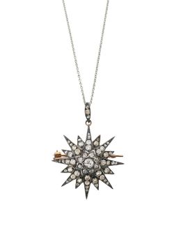 A late Victorian diamond set star brooch with removable necklace fitting