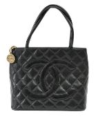 A Chanel 'Medallion' black caviar tote bag