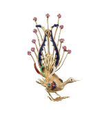 A peacock brooch with enamel and ruby plumage