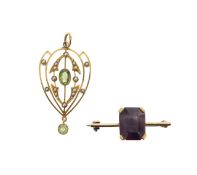 An Edwardian peridot and seed pearl pendant, and an amethyst brooch