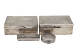 A pair of silver cigarette boxes, a compact and another