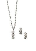 An 18ct white gold and diamond trio pendant and earrings