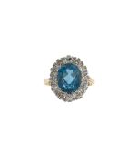 An 18ct gold, topaz and diamond cluster ring
