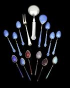 A collection of silver gilt and guilloché enamelled spoons