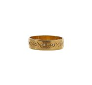 An 18ct yellow gold wedding band