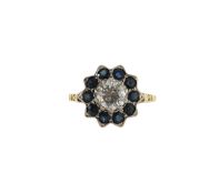 A diamond and sapphire cluster ring